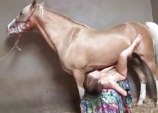 Slender babe fucking with a huge stallion