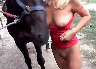 Blond-haired babe blows a horse