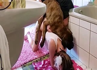 Masked chick raped by a dog in the bathroom