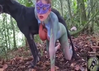 Outdoor fuck movie showing a MILF and her dog