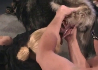 This slut has a mask on and she blows a doggie cock