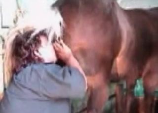 Filthy woman giving a rim job to a handsome horse
