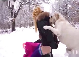 Amateur with a blond hair fucking a dog in the snow