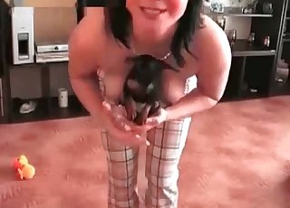 Slut with large breasts having all sorts of fun with a cute pet