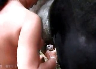 Black-haired gal is wnaking a horse man meat