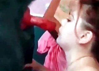 Pretty Japanese girl pummeling a dog