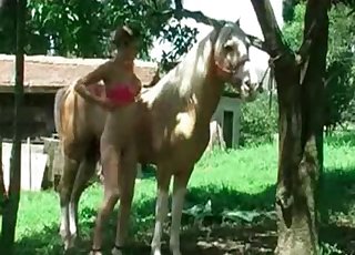 Thin woman teasing her horse